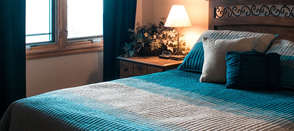 A mattress in a cozy bedroom